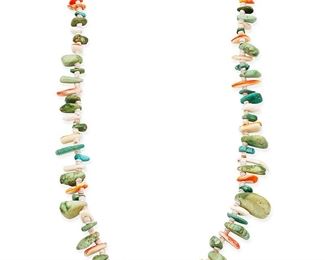 1088
Mid/late 20th century
A Pueblo Turquoise And Shell Necklace
A single strand tab necklace with nugget turquoise and spiny oyster tab beads
29" L x 1.25" H
Estimate: $200 - $400