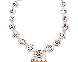 1111
Late 20th/21st century; Peru
An Ilaria Sterling Silver And Shell Necklace
Stamped: Ilaria / 950
A sterling silver graduated link necklace with repoussé swirl motifs suspending a central pendant with a large spiny oyster tab
20" L - 21.5" L x 2.75" H x 2" W
106.1 grams gross
Estimate: $200 - $400