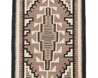 1114
Late 20th/21st century; Diné
A Navajo Two Grey Hills Textile
Woven in tan, grey, cream, and black wool with a central stepped diamond motif, stepped corners and sides, with a narrow sawtooth border
42.75" H x 33" W
Estimate: $300 - $500