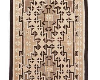 1115
Mid/late 20th century; Diné
A Navajo Two Grey Hills Textile
Finely woven in natural cream, grey, and dark brown wool in a conjoined double diamond motif and elaborate border
54.5" H x 36" W
Estimate: $600 - $800