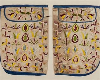 1119
Late 19th century; Canada
A Pair Of Nêhiyawak Plains Cree Quilled Leggings
Each hide legging with overall multicolored quillwork in foliate motifs, with top flaps, and each with a blue fabric lining and edged with blue wool twill tape, mounted to a beige backing fabric within a custom-made Plexiglas frame
Each legging: 18" H x 12.5" W approximately
Estimate: $2,000 - $3,000