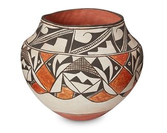 1122
Marie Z. Chino (1907-1982, Acoma Pueblo)
An Acoma Pueblo polychrome olla, mid/late 20th century
Signed to the underside: Marie Z. Chino / Acoma, N.M.
The ceramic vessel with abstract figural black on white decoration and terracotta slip glaze accents
8" H x 8.5" Dia.
Estimate: $700 - $900