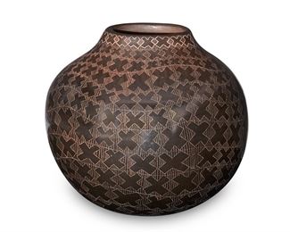 1123
Polly Rose Folwell (B. 1962, Santa Clara Pueblo) And Susan "Mesa Flower" Folwell (B. 1972, Santa Clara Pueblo)
A sgraffito pottery vessel, 1991
Signed and dated to the underside: Polly Rose Folwell / Mesa Flower / '91
The stout pot constructed out of burnished deep brown clay with incised X-motif banding
4" H x 4.5" Dia.
Estimate: $300 - $500
