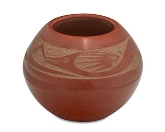1125
Tony Da (1940-2008, San Ildefonso Pueblo)
A sgraffito redware jar, late 20th/early 21st century
Signed to the underside: Tony Da
A burnished red slip glazed jar with wrap-around carved Avanyu serpent motif
3.125" H x 4" Dia.
Estimate: $1,000 - $1,500