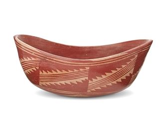 1126
20th century
A Puebloan Pottery Dough Bowl
Appears unsigned
With red painted geometric motifs over buff slip glaze
6" H x 13.25" W x 8.325" D
Estimate: $300 - $500