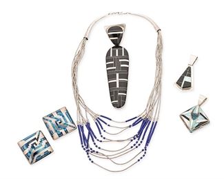 1149
Late 20th/21st century
A Group Of Southwest-Style Jewelry
Variously marked for maker and for sterling silver
Five works comprising a large DN sterling silver pendant with onyx and opal geometric inlay (4.75" H x 1.125" W), a Jay-Jay onyx and opal inlay pendant (2" H), a chunky opal, onyx and mother of pearl inlay pendant (2" H), a liquid silver and lapis bead multistrand necklace (17" L), and a pair of Mexican silver overlay earrings with blue glass (each: 1.125" H), 6 pieces
126.2 grams gross
Estimate: $200 - $400