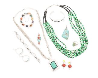 1151
Late 20th century
A Group Of Southwest-Style Jewelry
Ten works:
Raymond Kyasyousie (b. 1957, Hopi)
A Hopi silver overlay cuff bracelet
Stamped with conjoined RK
A narrow silver overlay cuff with wave motifs
6.875" total inner C x 0.375" H, with a 1.125" gap
A mixed group of nine jewelry items
Five marked for sterling; two marked for maker
Comprising two necklaces, including a WS sterling silver pendant with shadowbox set malachite suspended from a multistrand liquid silver necklace (24" L x 2.25" H), and a multistrand green stone bead necklace (25" L), as well as two sterling silver bracelets including a Mexican silver link bracelet with multistone inset cabochon lnks (7.75" L) and a textured sterling silver link bracelet (7.375" L), together with two stone pendants including a turquoise nugget pendant (2.75" H) and a sterling silver set stone pendant with turquoise and coral (2.25" H), a sterling silver ring with long oval set turquoise (ring size: 8), and two pairs of silver e