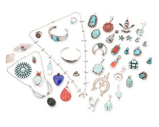 1156
Mid/late 20th century
A Large Group Of Southwest-Style Silver Jewelry
Twenty-two marked for sterling; thirteen variously marked for maker
A large group comprising two silver cuff bracelets with set turquoise, one a three-wire cuff with applied stamped flared silver plaques and a central bezel set stone (5.75" inner C x 1" H, with a 1" gap) and a stamped silver cuff with arrow and thunderbird motifs and small central stone (6.375" inner C x 0.625" H, with a 0.75" gap), as well as a sterling silver necklace with two incised silver feather motif links and a set onyx cabochon pendant (15.5" L x 1.5" H), and a liquid silver bead necklace with a small silver bird bead pendant and silver bird fetish beads ( 26" L), together with twenty-three silver and stone-set pendants in various styles, sizes and stones, including multistone inlay, turquoise, coal, spiney oyster, mother of pearl, agate and lapis, two pendant/brooches, and two naja pendants (largest: 2.75" H; smallest: 1" H), three sil