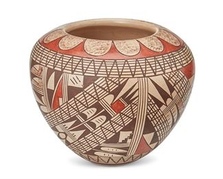 1178
Rondina Huma (B. 1947, Hopi-Tewa)
A polychrome jar, late 20th century
Signed to the underside: Rondina Huma
The shouldered vessel with medium shard geometric motifs in red and brown slip glaze on a buff ground
4.5" H x 5.25" Dia.
Estimate: $800 - $1,200