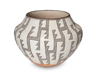1180
Marie Z. Chino (1907-1982, Acoma Pueblo)
A black on white olla, mid/late 20th century
Signed to the underside: Marie Z. Chino / Acoma, New Mexico
The large vessel decorated with black slip glaze in an "Anasazi Stepped" design on white ground and terracotta wash at the base
8.75" H x 10.5 Dia
Estimate: $200 - $400