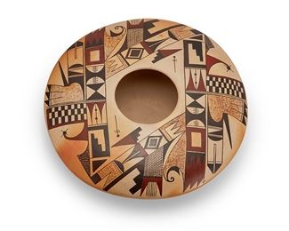 1179
Mark Tahbo (1958-2017, Hopi Tewa Pueblo)
A polychrome seed pot, late 20th century
Signed to underside: painted by Mark Tahbo; further marked indistinctly
The squat, wide vessel with geometric avian motifs painted in shades of brown and black on the buff ground
3.25" H x 10.25" W
Estimate: $1,000 - $1,500