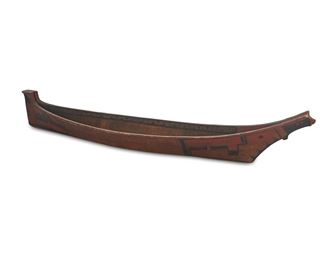 1198
Late 19th/early 20th century
A Northwest Coast Canoe Model
In carved wood with polychrome painted exterior geometric motifs and interior band
6.5" H x 38.25" W x 7.5" D
Estimate: $800 - $1,200