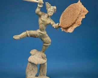 1203
Davie Atchealak
1947-2006, Inuit; Frobisher Bay/Iqaluit
Carved Figure With Drum And Drumstick
Stone, bone, and sea sponge
Signed to underside: Davie Atchealak / ©
15" H x 14.5" W x 6" D
Estimate: $2,000 - $4,000