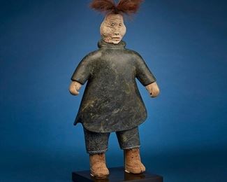 1204
Joseph Shuqslak
b. 1958, Inuit; Gjoa Haven/Uqsuqtuuq
Carved Standing Figure, Circa 1991
Stone, whalebone, and fur on bronze base
Appears unsigned
Figure: 21.5" H x 10.75" W x 5" D; Base: 1.125" H x 8" W x 8" D
Estimate: $2,000 - $3,000