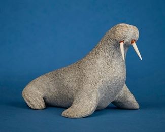 1207
John Kaunak
b. 1941, Inuit; Repulse Bay/Naujaat
Carved Walrus With Tusks
Stone and bone
Signed to underside: John Kaunak / Repulse Bay / N.W.J.; further marked with sticker: Canada eskimo art
4.625' H x 5.25" W x 7.25" D
Estimate: $200 - $400