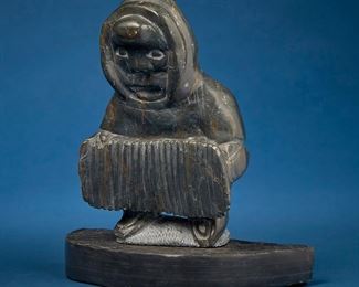 1224
Johnny Inukpuk
1911-2007, Inuit; Port Harrison/Inukjuak
Accordion Player, Circa 1999
Stone
Appears unsigned
11" H x 10" W x 4.75" D
Estimate: $400 - $600