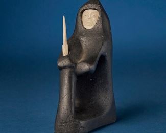 1226
Matiusie Iyaituk
b. 1950, Inuit; Ivujivik
Carved Figure With Inset Face And Knife
Stone, bone, and caribou antler
Marked syllabically; further marked: EA / © / 3-1; further marked with stickers: I-16803 / 195 / [partially illegible] / 3-16085 / Matthew Iyaituk / Canada eskimo art esquimau / [graphic of figure building igloo] / 3
5.25" H x 2" W x 4.25" D
Estimate: $400 - $600