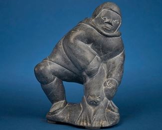 1228
Daniel Nuluki Kuanana
b. 1936, Inuit; Povungnituk/Puvirnituq
Carved Figure Skinning A Seal
Stone
Signed syllabically to underside and numbered: 171344; further marked with sticker: canada eskimo art
8.25" H x 6" W x 5.25" D
Estimate: $200 - $400