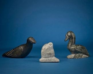 1244
Three Inuit Carved Stone Figures
Three works:

Allie Kasudluak
(1926-1982, Inuit; Port Harrison/Inukjuak)
Carved bird figure with incised feathers
Stone
Signed syllabically to underside
3.25" H x 6.5" W x 2.75" D

Josie Pamiutu Papialuk
(1918-1996, Inuit; Povungnituk/Puvirnituq)
Carved seal head breaching ice, circa 1986
Stone
Signed to underside: Josie Papialook [sic] / ?© / 81; further marked with partially illegible disc number
2.875" H x 2.5" W x 2.75" D

Davidee Saumik
(1925-1984, Inuit; Port Harrison/Inukjuak)
Carved duck
Stone
Signed syllabically to underside; further marked: 187391
4" H x 4.25" W x 2" D

3 pieces
Estimate: $300 - $500