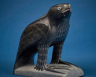 1251
Tamusi Qumalu Tukula (Thomassie Tookalook)
b. 1945, Inuit; Povungnituk/Puvirnituq
Carved Falcon Figure, 1977
Stone
Signed to underside: Thomassie Tookalook / [syllabics] / © 77; further marked with sticker: canada eskimo art esquimau
12" H x 6.25" W x 12" D
Estimate: $800 - $1,200