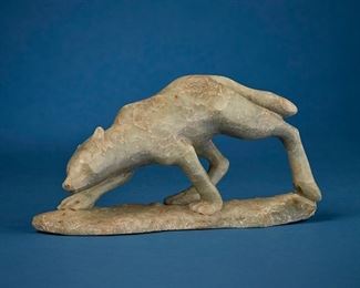 1255
Enook Manomie
b. 1941, Inuit; Frobisher Bay/Iqaluit
Carved Wolf Figure
Stone
Signed to underside: [syllabics] / Enook / 1981 / C; further marked with sticker: Enook Manomie Frobisher Bay
5.25" H x 10.75" W x 3.25" D
Estimate: $200 - $400