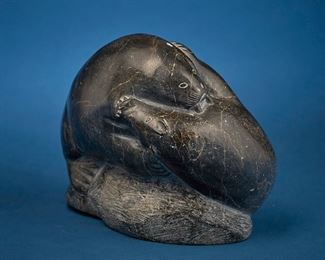 1256
Lucassie Echalook
b. 1904, Inuit; Port Harrison/Inukjuak
Carved Bear And Walrus In A Death Struggle
Stone
Signed syllabically to underside and marked with artist's disc number: E9 1582; further marked with sticker: canadian eskimo art
6.5" H x 8.375" W x 5.875" D
Estimate: $400 - $600