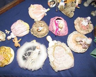 Antique powder puffs with porcelain handles. Some with swan feathers 