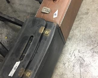 Hard camera cases, one is on wheels