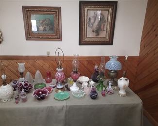 Kerosene lamps, Aladdin lamps, cranberry glass, opalescent lamp, pair of glass shades etched 'Colorado'.  This collection of glassware is located offsite and available for sale June 1-4.