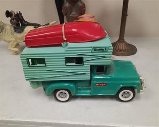 Vintage Buddy L camper with boat in original condition.  The pictured items are located offsite and available for sale June1-4.