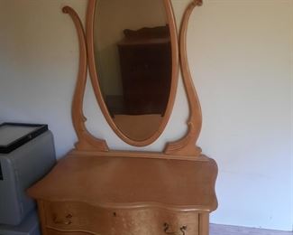 Birdseye maple dresser with wishbone mirror.  This item is located at the 1898 home and will be available for sale June 3-4. 