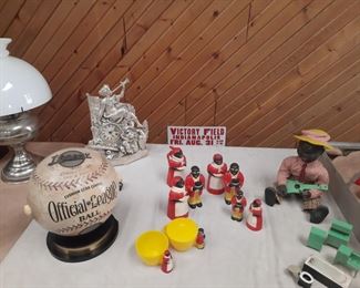 1940's Baseball radio, black collectibles, old oil lamp with glass shade, old miniature metal toy furniture.  These items are located offsite and available for sale June 1-4.
