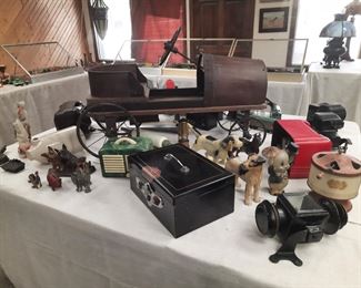 Antique , old radios, oldchild's push car, auto lamp, toy washing machine, old metal figural items, antique cash box (Japan) with key.  These items are located offsite and available for sale June 1-4.