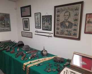 Two Civil War swords with scabbards, antique manacles, old, authentic 1865 Lincoln poster, signed General McArthur photo, 48 star USA framed flag, Western knife logo display stand and numerous knives are located offsite and available for sale June1 -4.