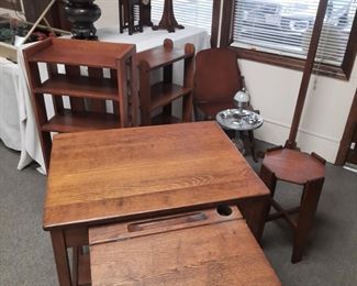 An antique oak desk with slid out/ lift top compartment. This desk is located offsite and available June 1-4.