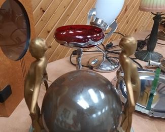 An Art Deco figural lamp with ball, Rocket lamp, chrome accessories. These items are located offsite and available June 1-4.