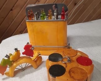 Bakelite mini bar with cocktail sticks, small poker chip set, animal birthday candles.  These items are located offsite and available June 1-4.