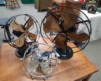 Vintage Robbins & Myers black fan with brass blades, 1930's Emerson black fan with brass blades, vintage Knapp Monarch "Jack Frost" silver fan.  All are in working order. These fans are located offsite and available June 1-4.