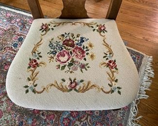detail of needlepoint dining chairs