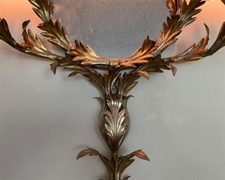 Fun foliate metal sconce with mirror