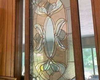 Wood framed stained glass window