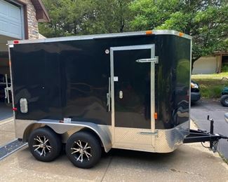 Very NICE 2016 Garaged kept enclosed, custom lined utility trailer.
