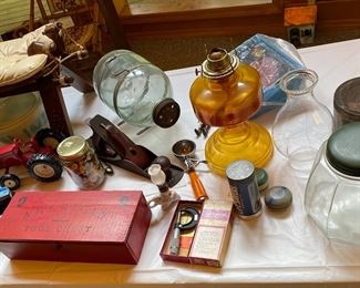 Antique oil lamp, Vintage Minnow trap, with vintage toys and Antique USA wood plane