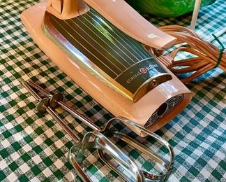 This GE Pink Vintage hand mixer still works.