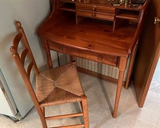 Vintage Yield House solid pine paymaster desk; rush seat chair in excellent condition.