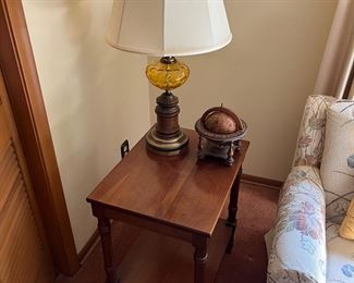 One of two matching Carl Forslund accent/side tables; one of two matching vintage table lamps; globe by Olde World Globe (Italy).