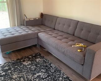 Contemporary gray sectional with chaise lounge end piece
$1800
