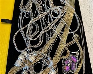 Lots of sterling earrings and necklaces .925