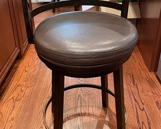 Pair of Leather Swivel Counter Stools With Brass Footplate. 26” Seat Height. Photo 1 of 2.