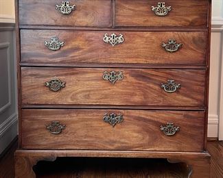 Antique Flame Mahogany Chest of Drawers with Brass Pulls & Bracket Feet. Circa 1750s. Measures 38” W x 20” D x 35” H. Photo 1 of 4.